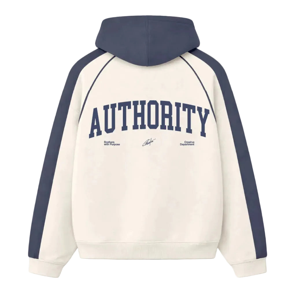 Crème hoodie met marineblauwe capuchon en raglanmouwen, AUTHORITY-tekst op rug.
